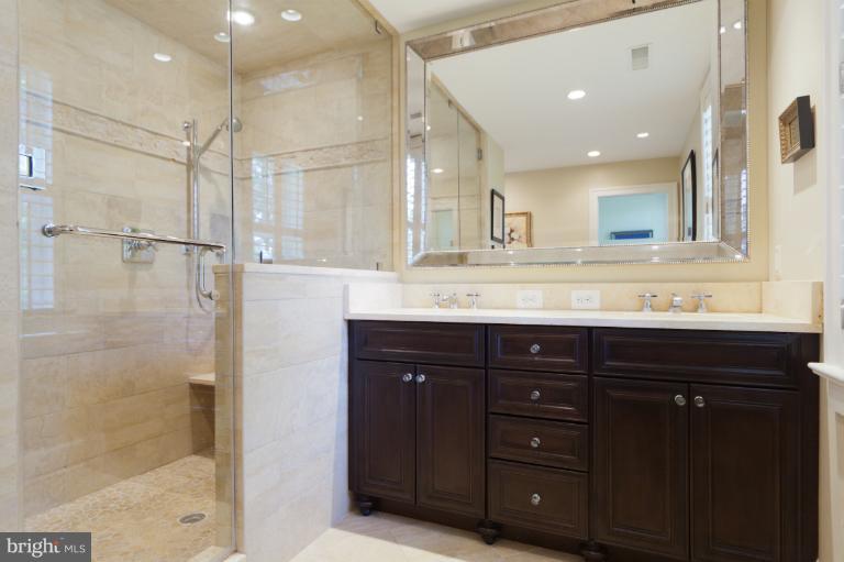 2012 South Arlington Ridge Road Arlington, VA 22202 - Photo 20 of 30 a bathroom with a granite countertop sink mirror and double