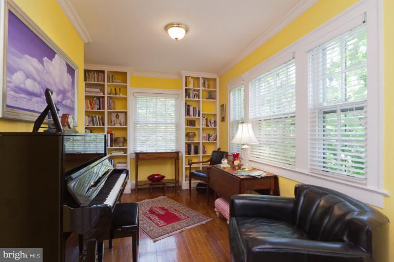 2012 South Arlington Ridge Road Arlington, VA 22202 - Photo 3 of 30 a living room with fireplace furniture and a flat screen tv