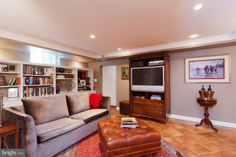 2012 South Arlington Ridge Road Arlington, VA 22202 - Photo 22 of 30 a living room with furniture and a flat screen tv