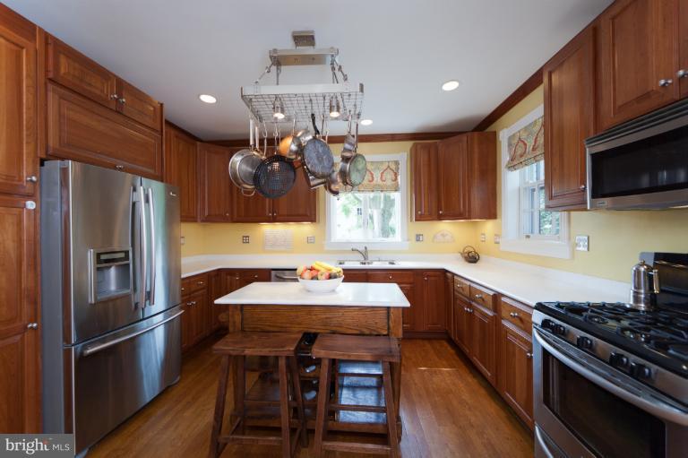 2012 South Arlington Ridge Road Arlington, VA 22202 - Photo 29 of 30 a kitchen with kitchen island a sink stove and refrigerator