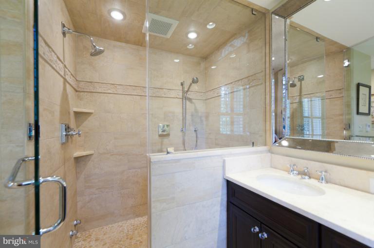 2012 South Arlington Ridge Road Arlington, VA 22202 - Photo 4 of 30 a bathroom with a double vanity sink mirror and shower