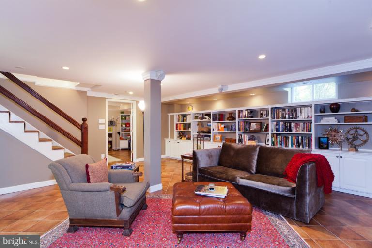 2012 South Arlington Ridge Road Arlington, VA 22202 - Photo 6 of 30 a living room with furniture and a book shelf