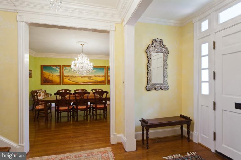 2012 South Arlington Ridge Road Arlington, VA 22202 - Photo 7 of 30 a dining room with furniture a rug and a chandelier