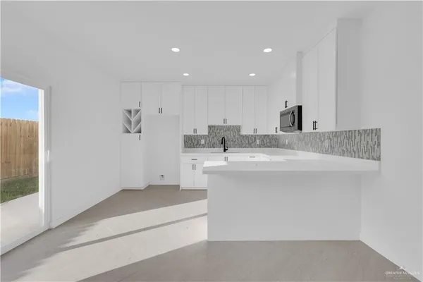 a bathroom with a sink double vanity and a mirror