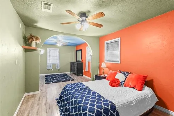 a bedroom with a bed and window