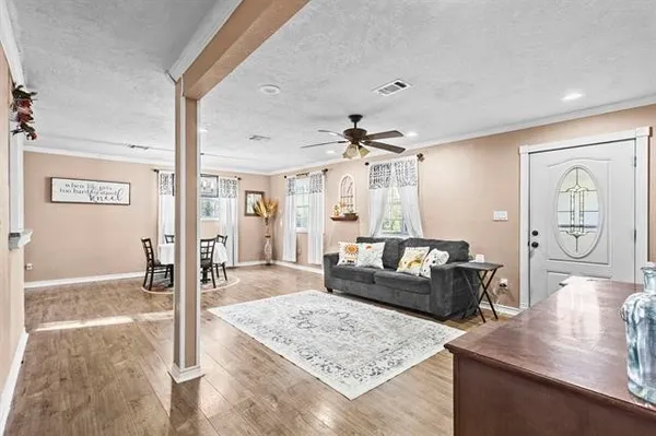 a living room with furniture and a table