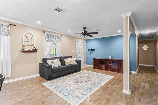 a living room with furniture and a rug