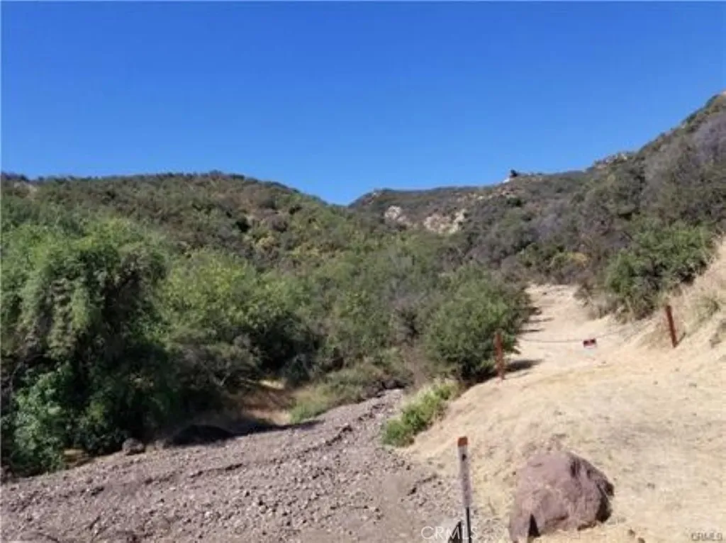 0 Triunfo Canyon Road Agoura Hills, CA 91301 - Photo 4 of 7 a view of a dry yard with mountains in the background
