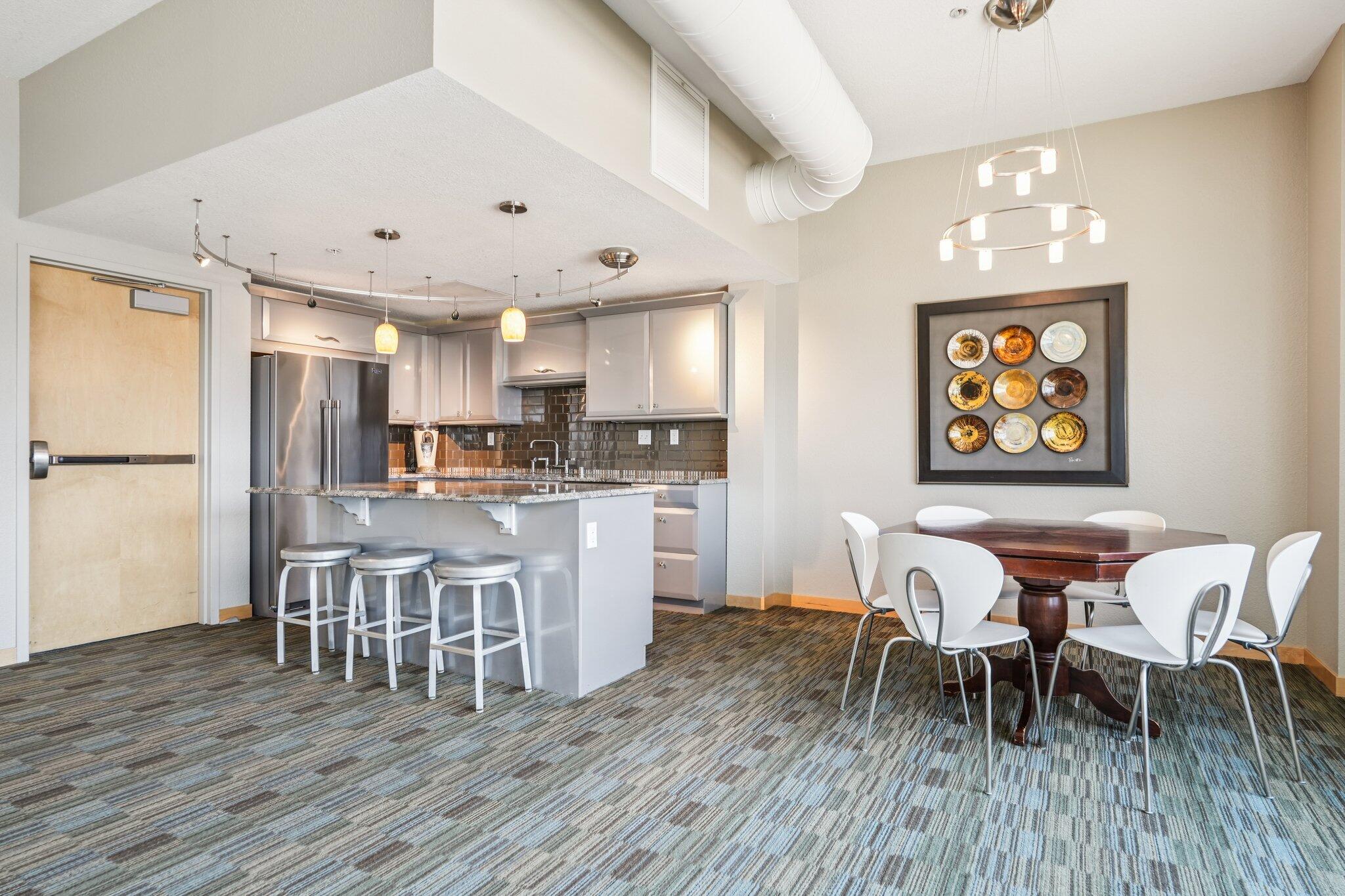 106 West Seeboth Street, Unit 908 Milwaukee, WI 53204 - Photo 31 of 48 Enjoy the Social Networking Room, with Pool tables, kitchen, Poker Table, Cocktail high top tables, TV and seating area.