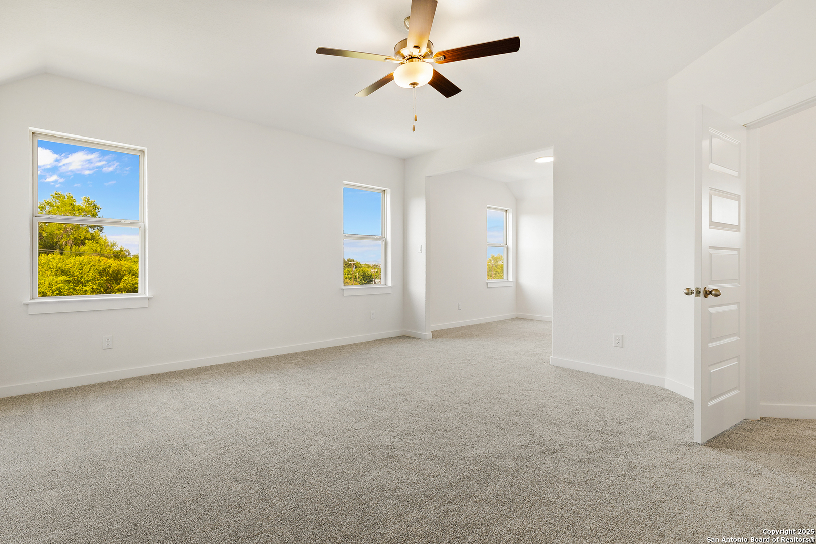 116 Vertex Loop San Antonio, TX 78238 - Photo 19 of 27 an empty room with windows and fan