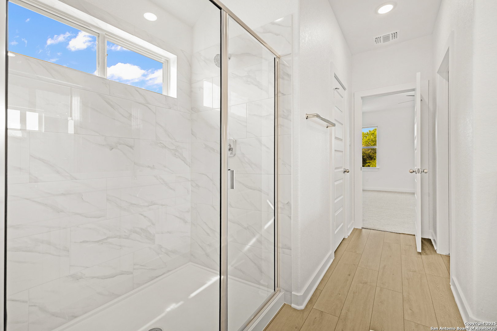 116 Vertex Loop San Antonio, TX 78238 - Photo 24 of 27 a bathroom with a bathtub and shower