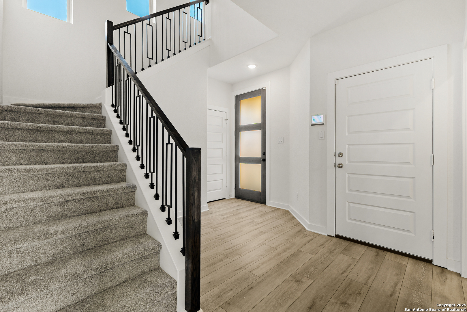 116 Vertex Loop San Antonio, TX 78238 - Photo 5 of 27 a view of entryway with wooden floor and stairs