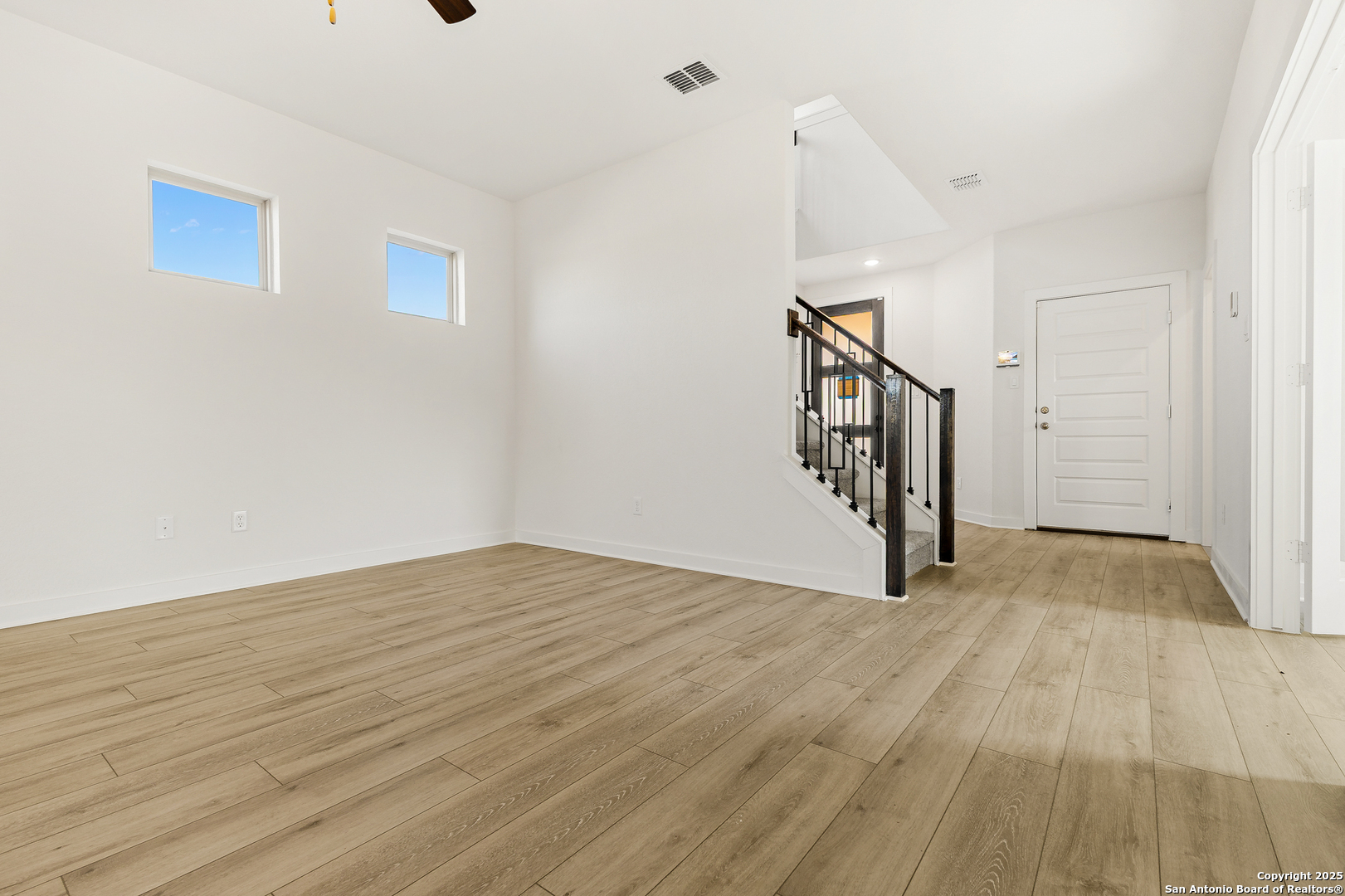 116 Vertex Loop San Antonio, TX 78238 - Photo 10 of 27 a view of an empty room with wooden floor and stairs