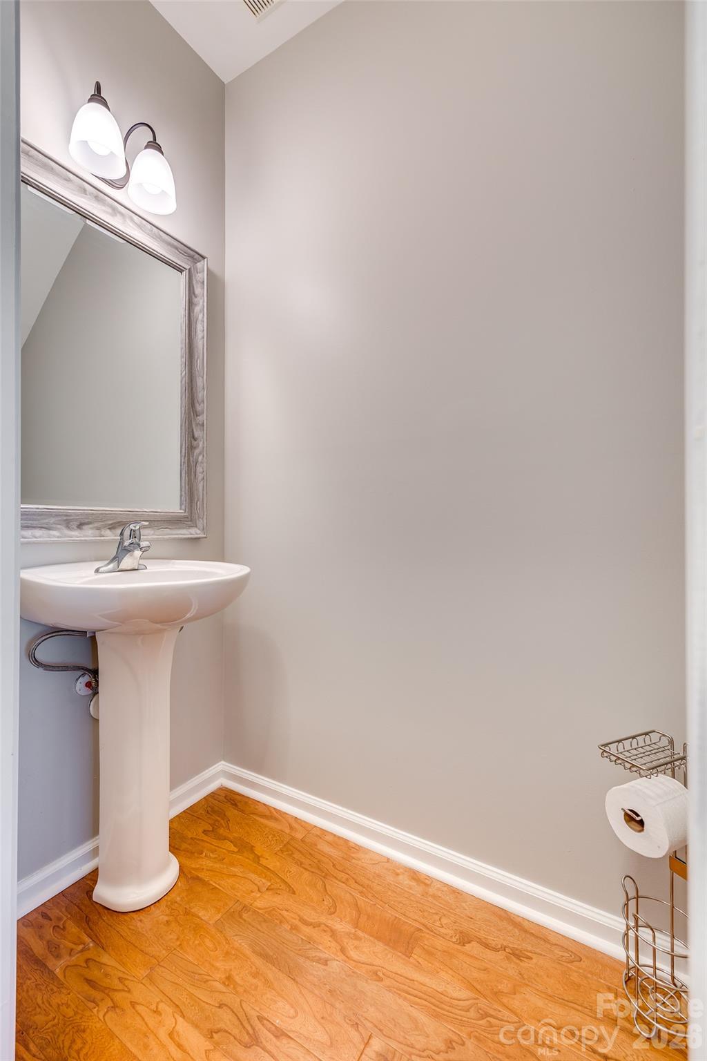 618 Bayou Circle Clover, SC 29710 - Photo 18 of 31 a bathroom with a sink a mirror and a toilet