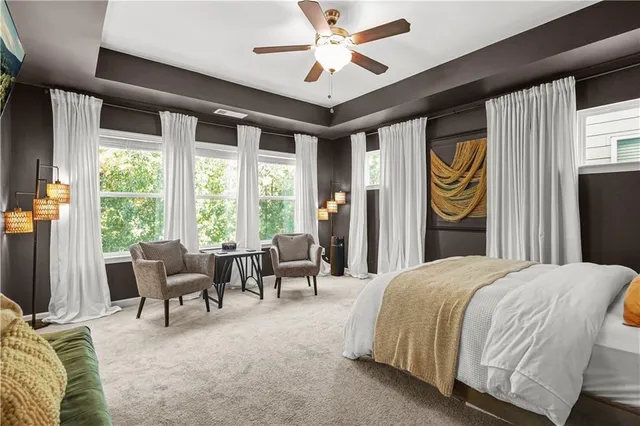 a bedroom with a bed and glass walk in closet