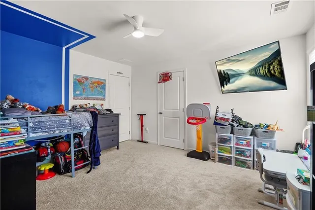 a children room with furniture and closet