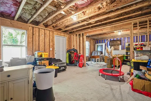 a room with furniture and musical instruments