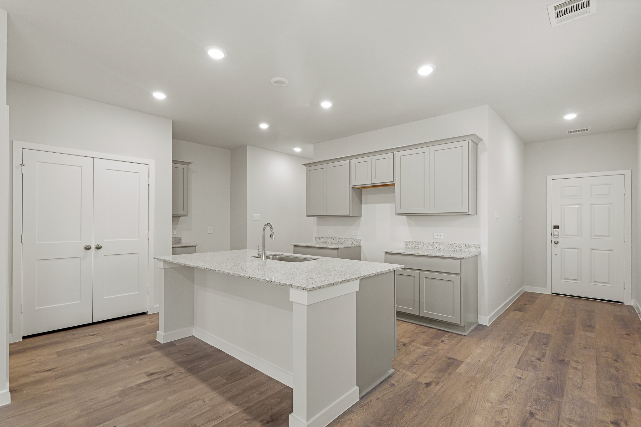 16715 Holly Street Porter, TX 77365 - Photo 14 of 26 a kitchen with white cabinets appliances and sink