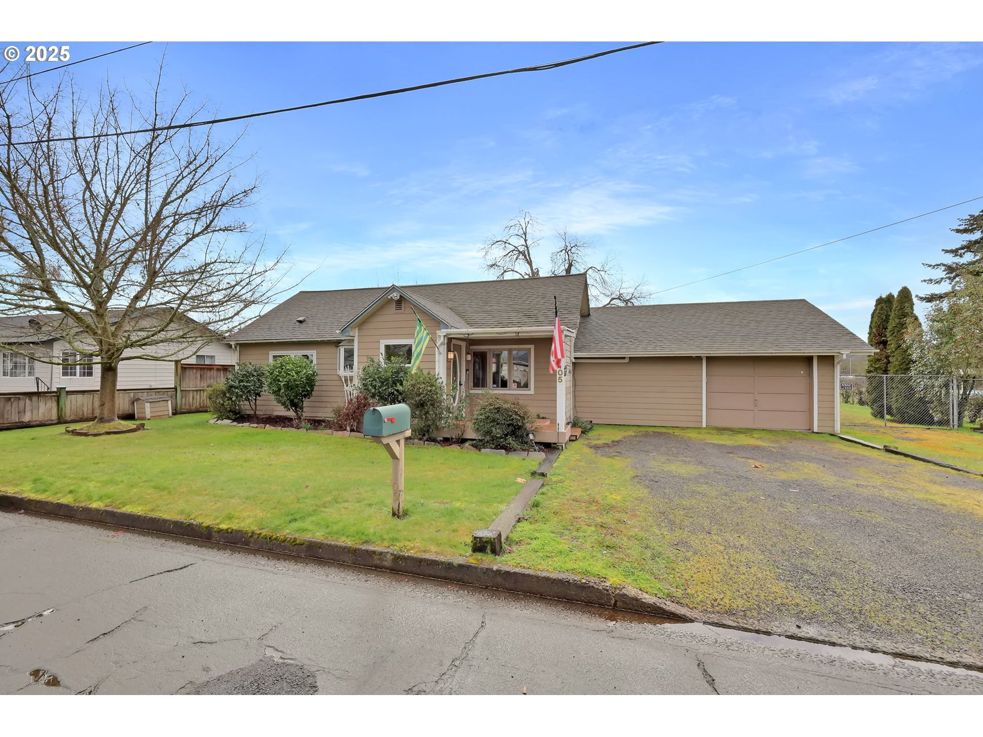 1105 West Fairview Drive Springfield, OR 97477 - Photo 1 of 46 a front view of a house with a yard and garage