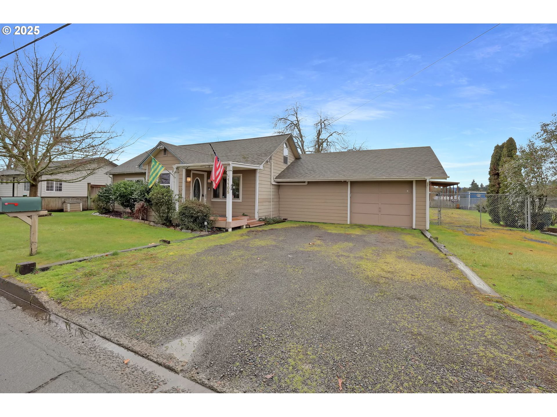 1105 West Fairview Drive Springfield, OR 97477 - Photo 2 of 46 a front view of a house with a yard and garage