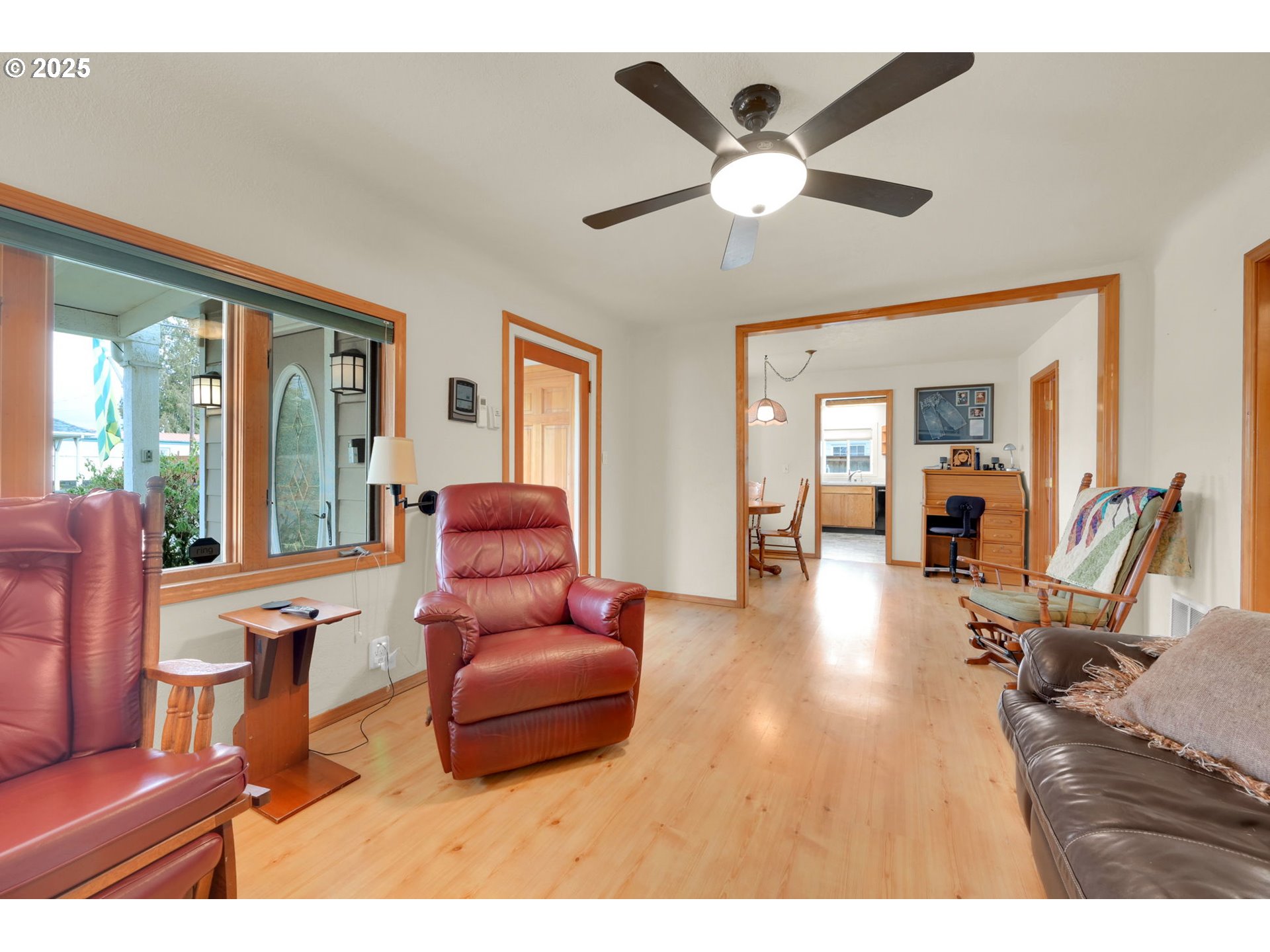 1105 West Fairview Drive Springfield, OR 97477 - Photo 8 of 46 a living room with furniture ceiling fan and a large window