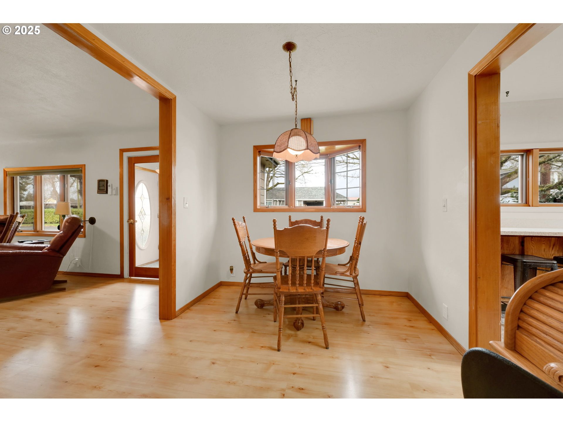 1105 West Fairview Drive Springfield, OR 97477 - Photo 10 of 46 a view of a dining room with furniture window and wooden floor