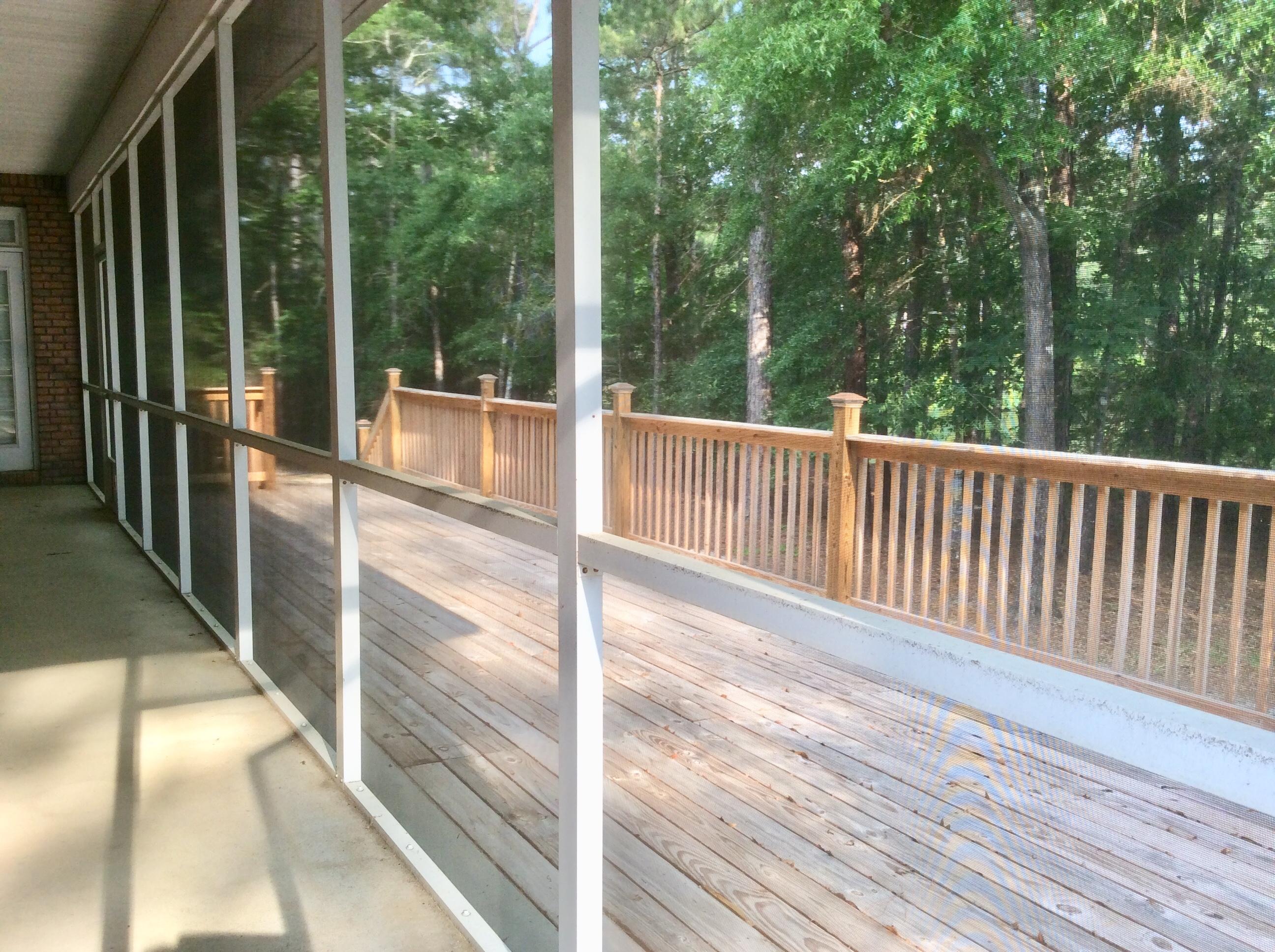 6089 Clear Creek Road Crestview, FL 32539 - Photo 31 of 38 a view of a balcony with floor to ceiling windows with wooden floor