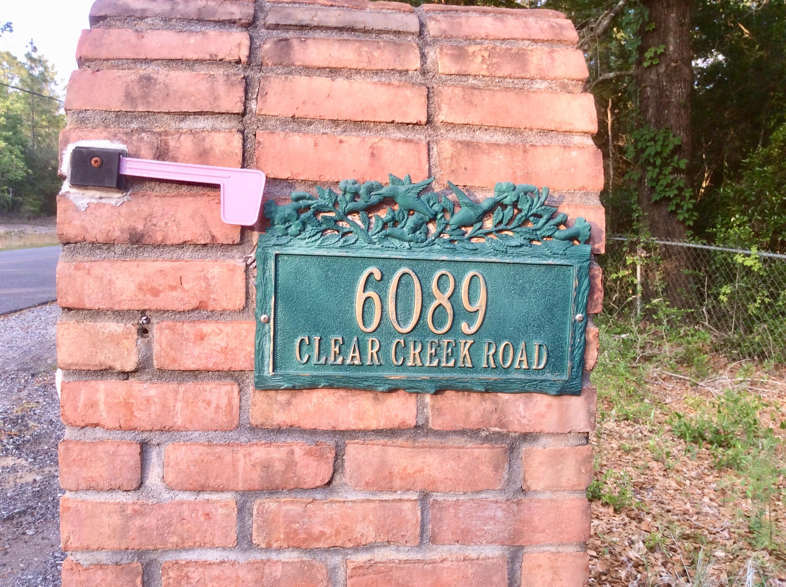 6089 Clear Creek Road Crestview, FL 32539 - Photo 38 of 38 a sign on the side of a building