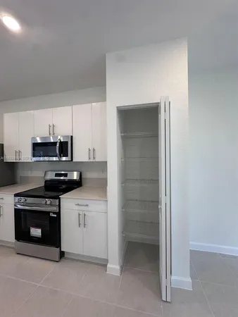 a view of the hall with a couch