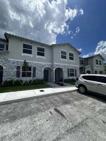 a view of a car parked in front of a house