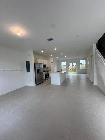 a view of a hallway with stairs