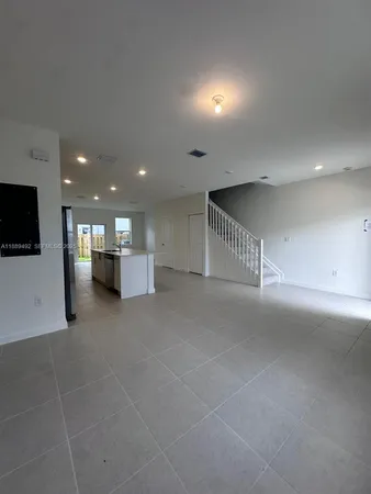 a view of a hall with stairs