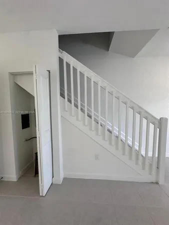 a view of an empty room and a window