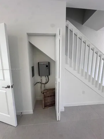 a view of an empty room and a window