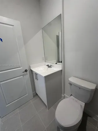 a bathroom with a shower and toilet