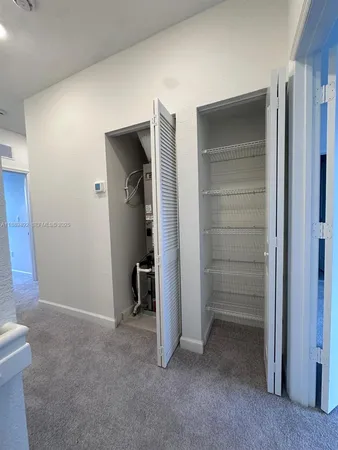 a view of a room that has a large window