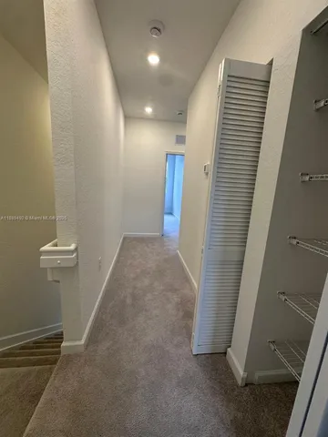 a view of a room that has a large window