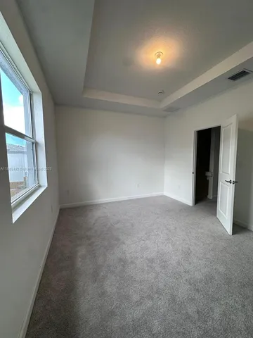a view of a backyard with potted plants