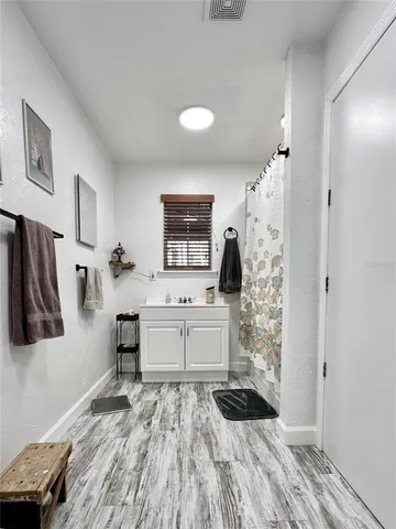 a kitchen with stainless steel appliances a refrigerator and a stove top oven