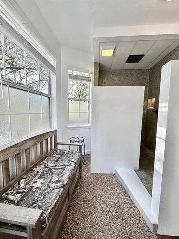 a bathroom with a sink a vanity a lamp and a mirror