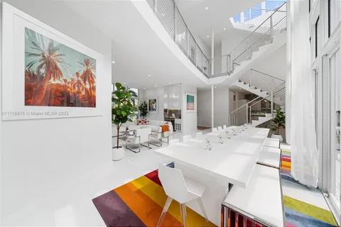 a view of a living room and entryway