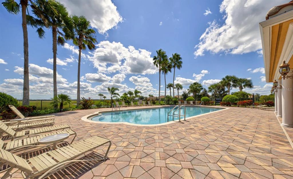 3405 Hyperion Way Southeast Palm Bay, FL 32909 - Photo 14 of 17 a view of a swimming pool with a lounge chairs