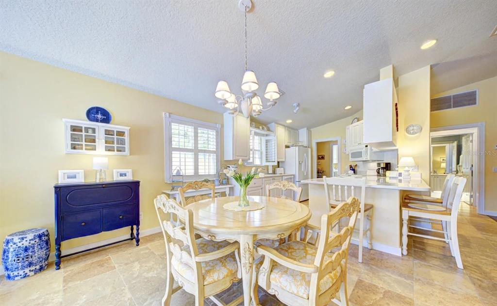 3405 Hyperion Way Southeast Palm Bay, FL 32909 - Photo 4 of 17 a view of a dining room with furniture and chandelier