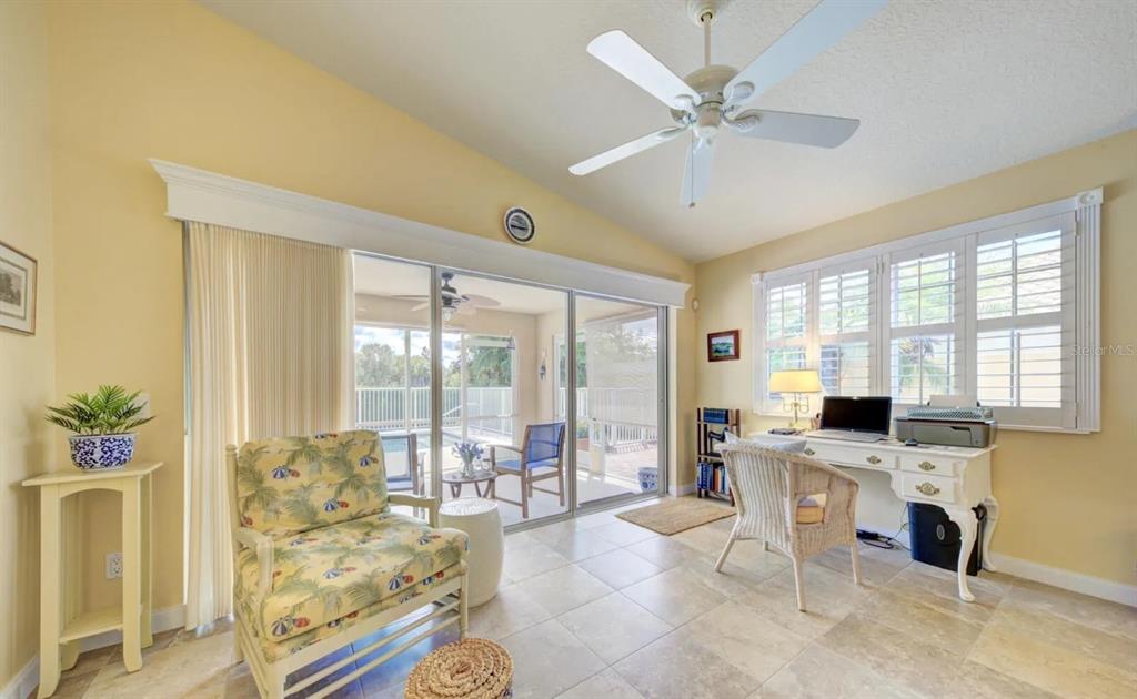 3405 Hyperion Way Southeast Palm Bay, FL 32909 - Photo 5 of 17 a living room with furniture a fireplace and a table