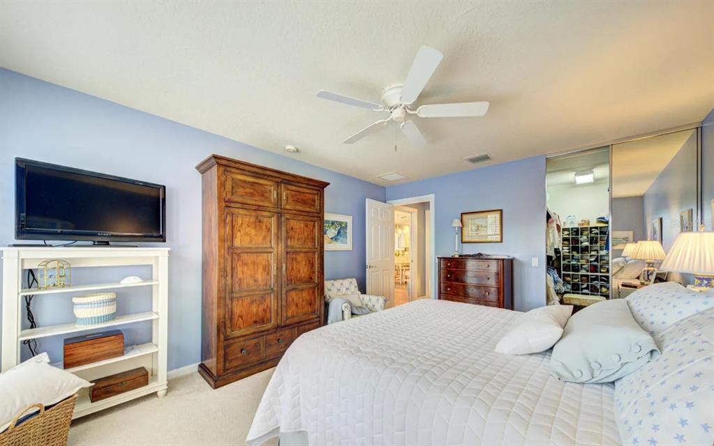 3405 Hyperion Way Southeast Palm Bay, FL 32909 - Photo 7 of 17 a bedroom with a large bed and a tv