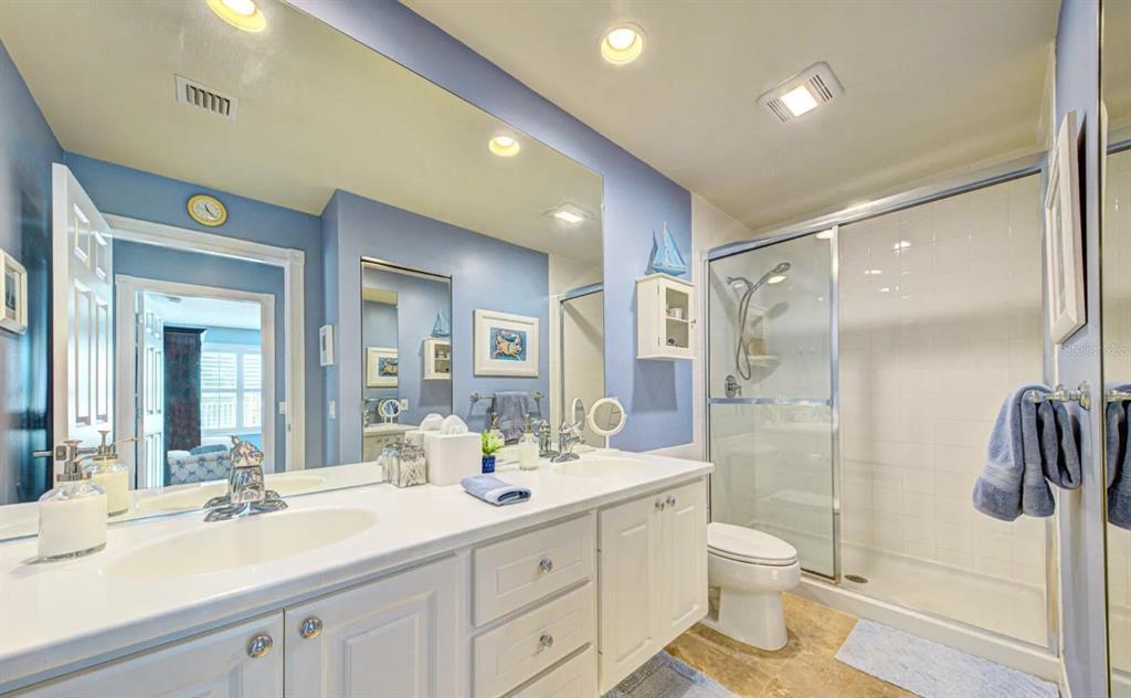 3405 Hyperion Way Southeast Palm Bay, FL 32909 - Photo 8 of 17 a bathroom with a sink a toilet and shower