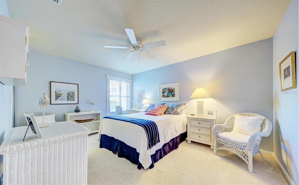 3405 Hyperion Way Southeast Palm Bay, FL 32909 - Photo 9 of 17 a bed room with a bed and a chair