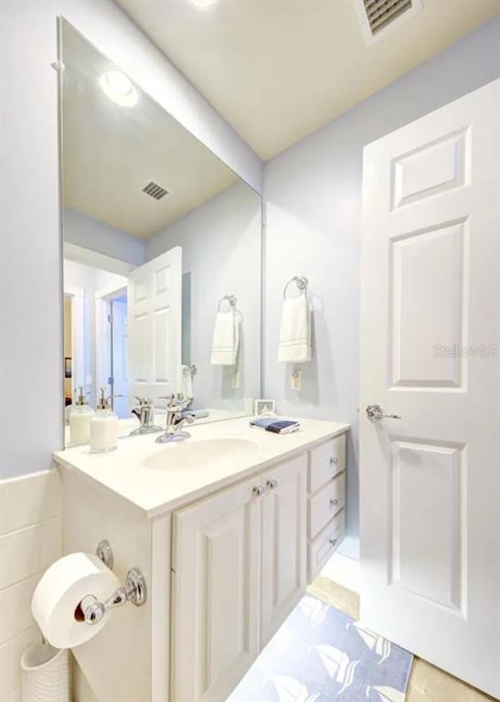 3405 Hyperion Way Southeast Palm Bay, FL 32909 - Photo 10 of 17 a bathroom with a double vanity sink mirror and