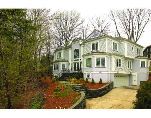 66 Mason Terrace Brookline, MA 02446 - Photo 1 of 13 a front view of a house with yard porch and sitting area