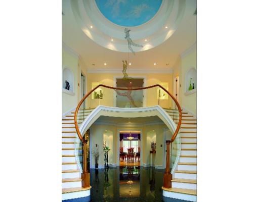 66 Mason Terrace Brookline, MA 02446 - Photo 2 of 13 a view of a hallway with a chandelier